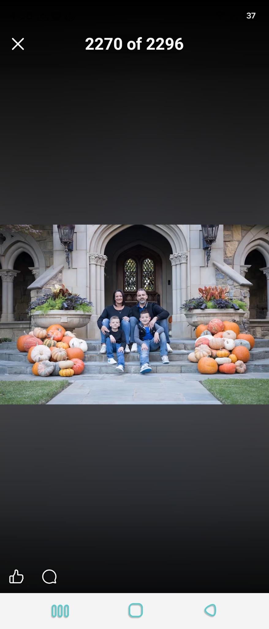 Anthony and Tessa James seated with Layden and Kyser on the steps of a stone house